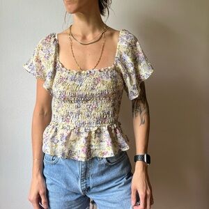 Floral smocked astr the label top